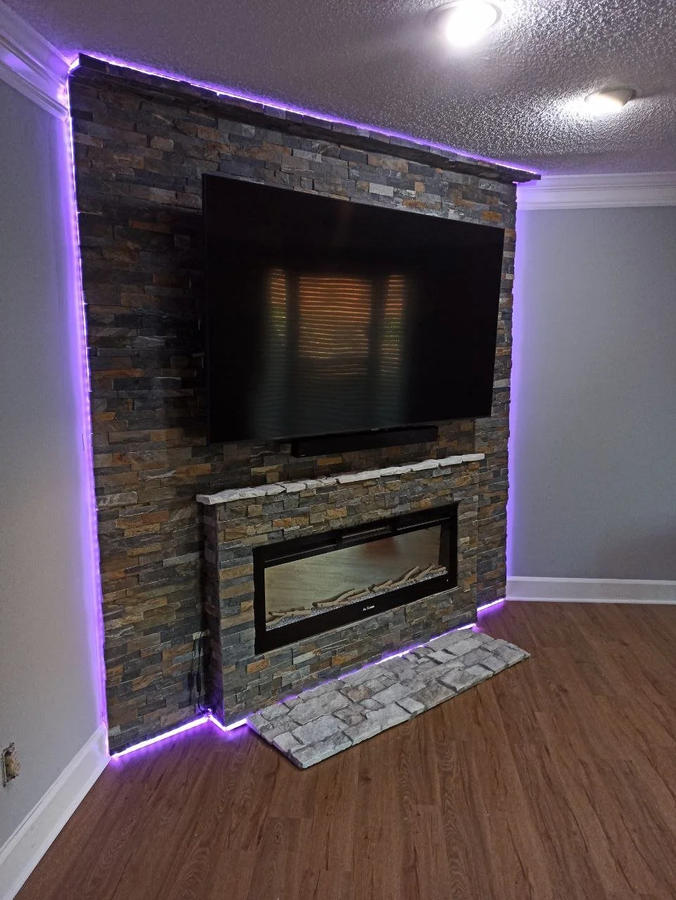 Modern Fireplace Media Wall with Stone Cladding – Atlanta, Georgia