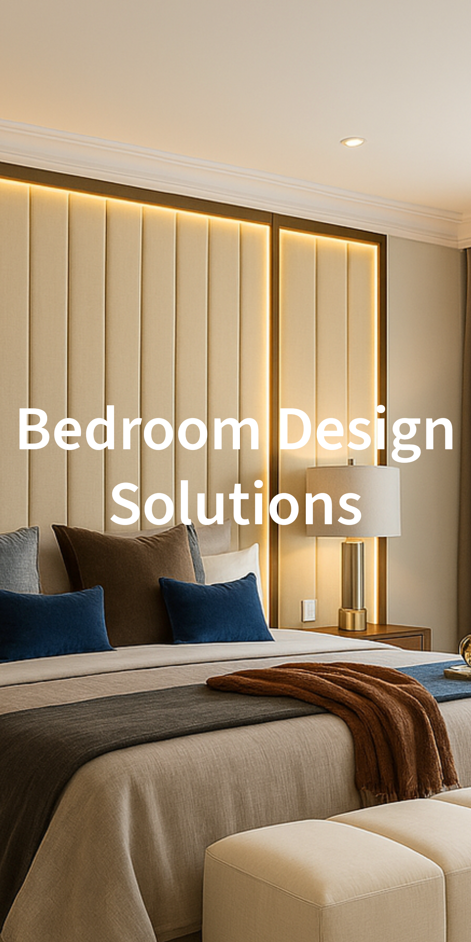 Decorated bedroom with beige upholstered bed, multiple pillows, bedside lamp, and warm lighting panels on the wall.
