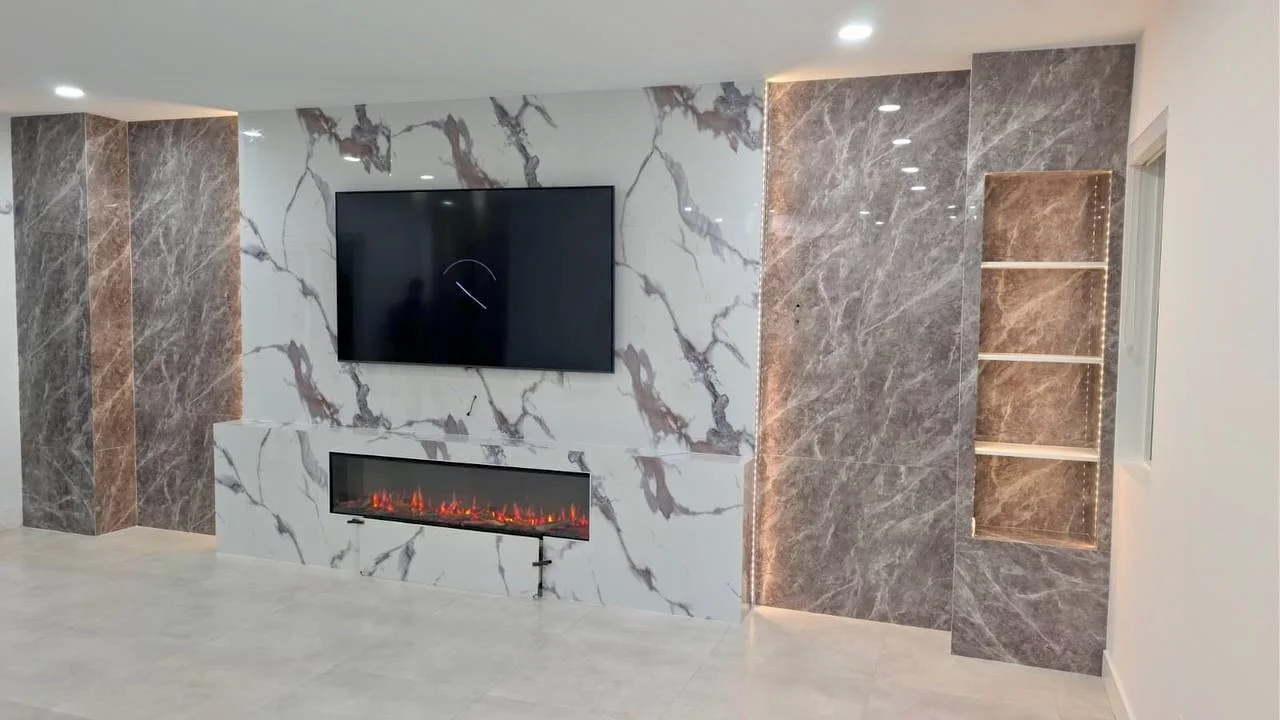 luxury marble media wall with fireplace and LED columns in Miami