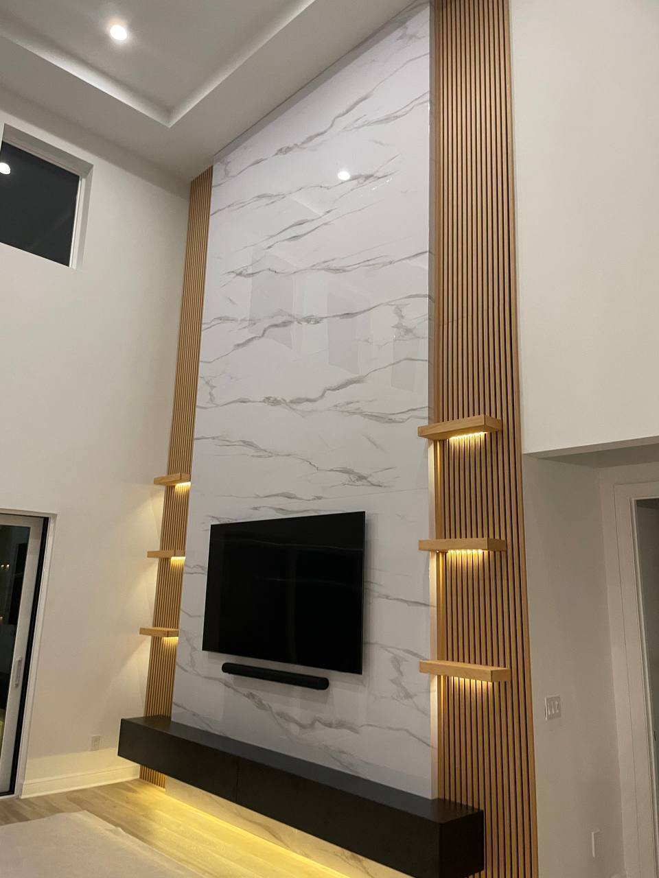 Tampa, FL - 20-Foot Media Wall with Marble Panels and Wood Slat Accents