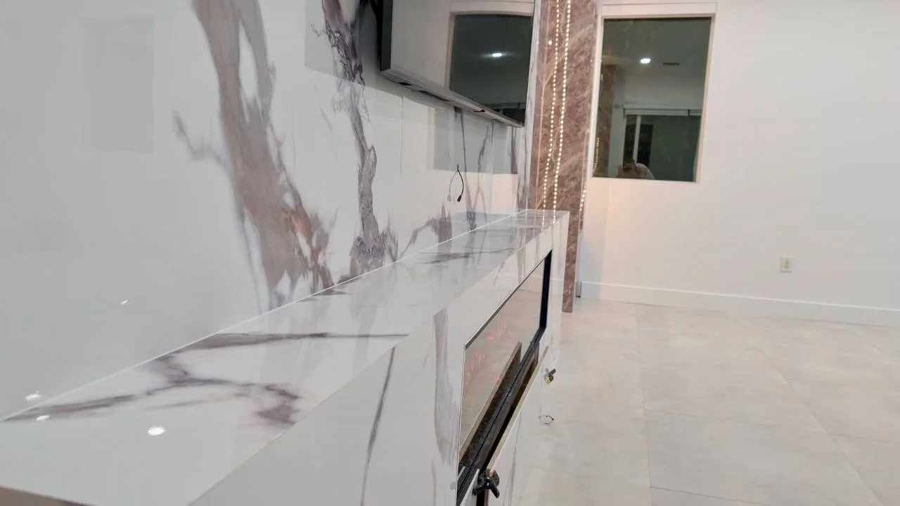 close-up of marble fireplace surface with linear electric fireplace