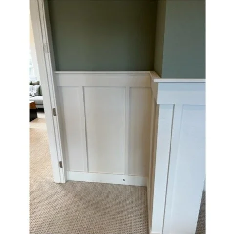 Modern white wainscoting corner detail in bedroom remodel project