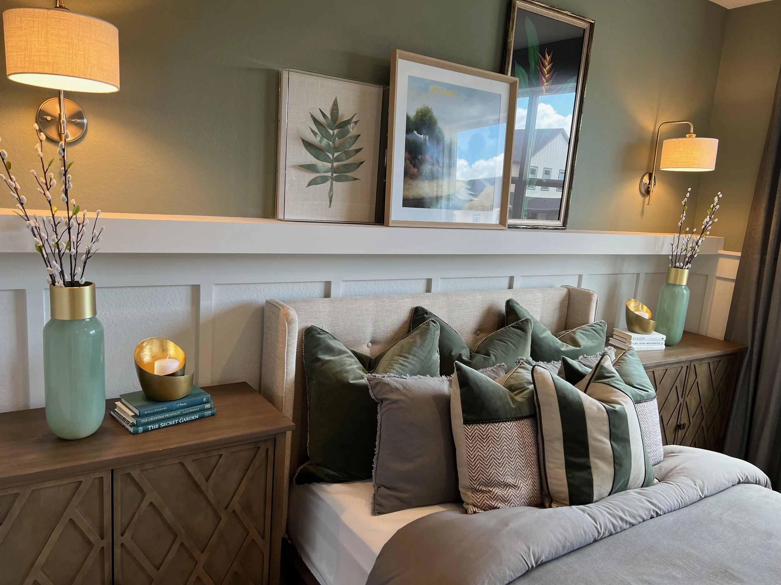Luxury bedroom accent wall with decorative trim and green paint in Orlando area