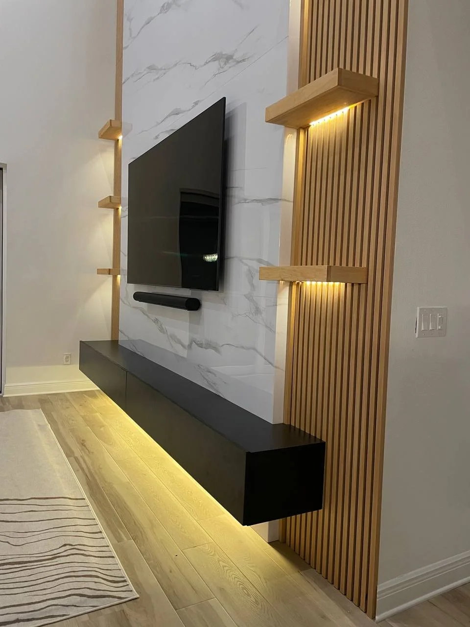 Modern 20-foot media wall with floating cabinet and LED lighting in Tampa