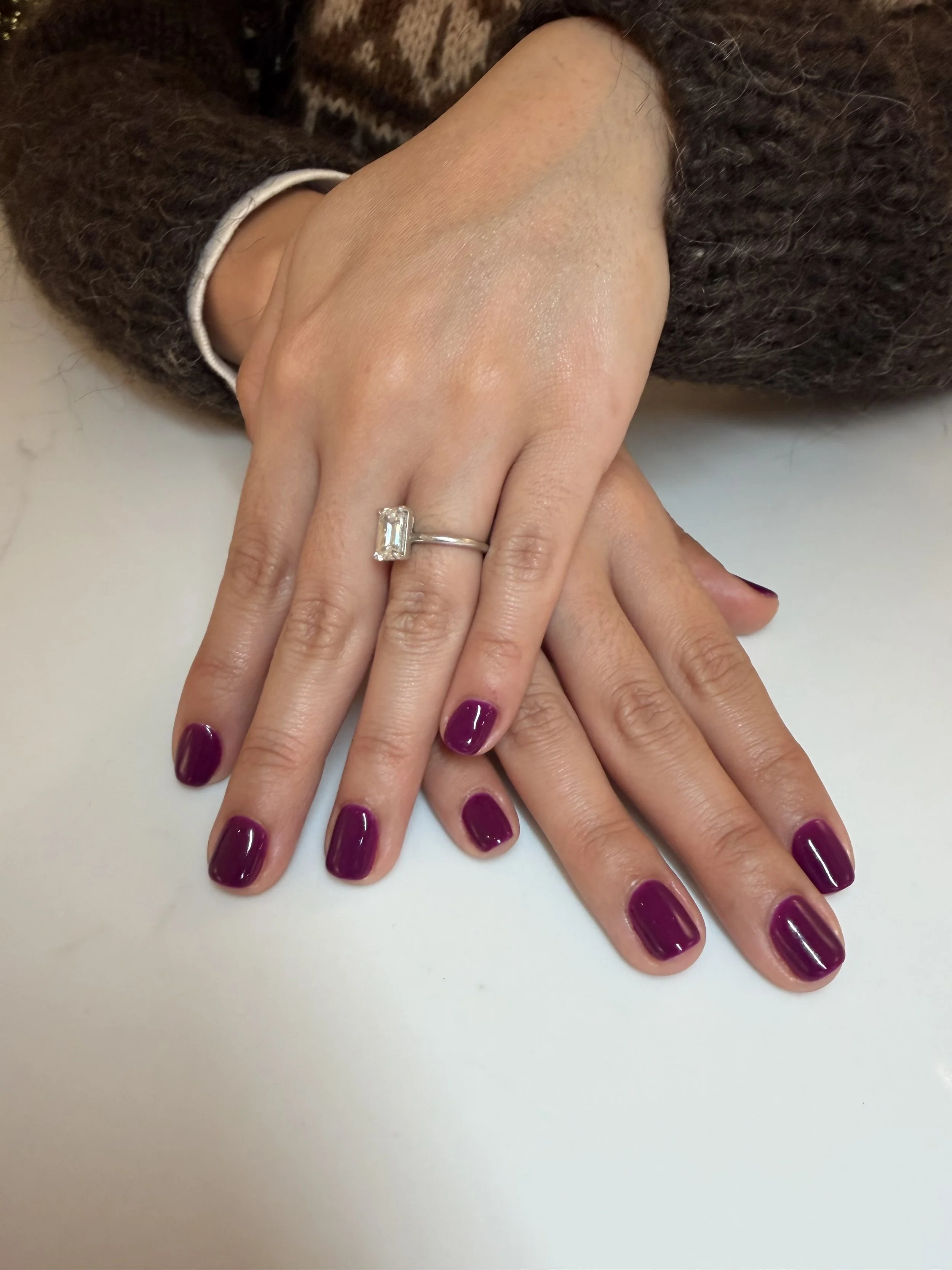 Gel manicure with a purple polish