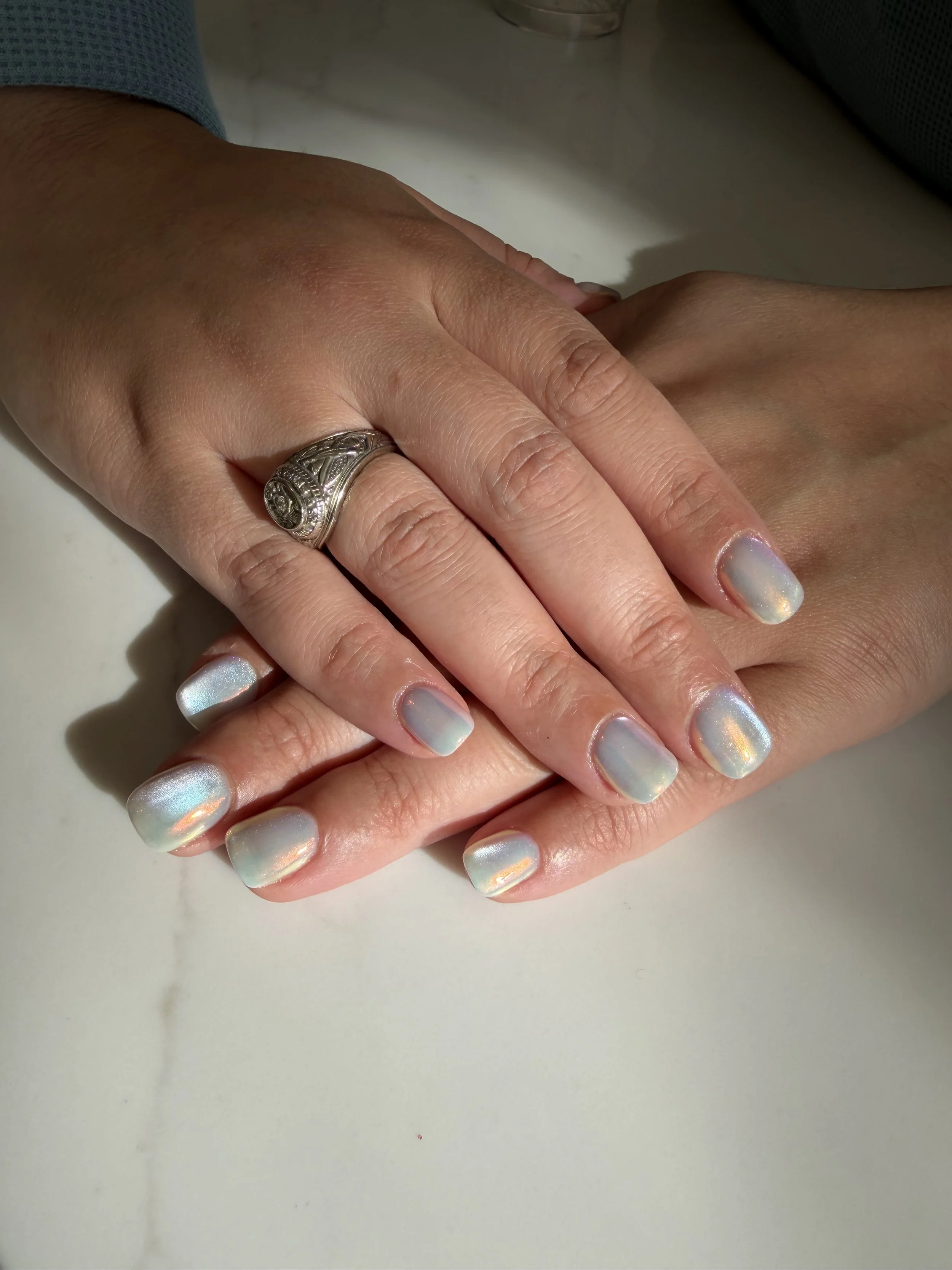 Builder Gel / Structured Gel with a milky white base, a silver cat eye, and chrome