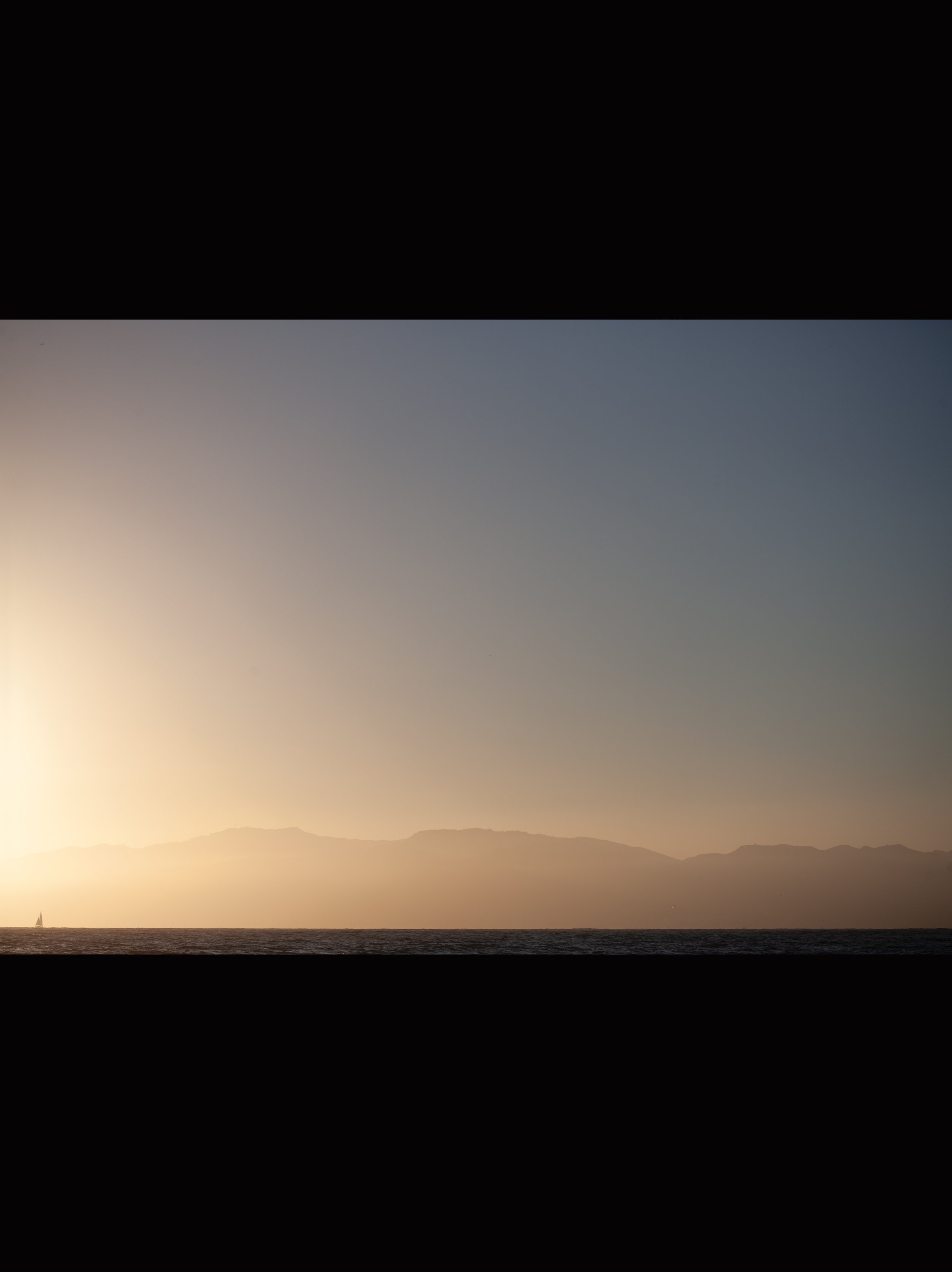 "Sailboat sails into Sunset"