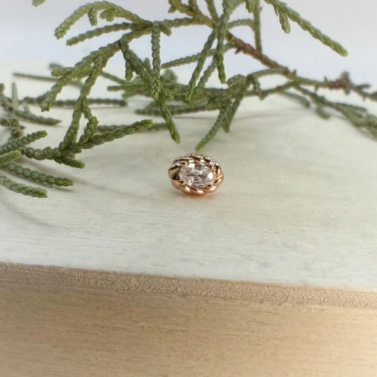 A new braided rose gold oval from our friends at @modernmoodbodyjewelry - This piece would work well for most ear piercings, particularly something like a conch!!