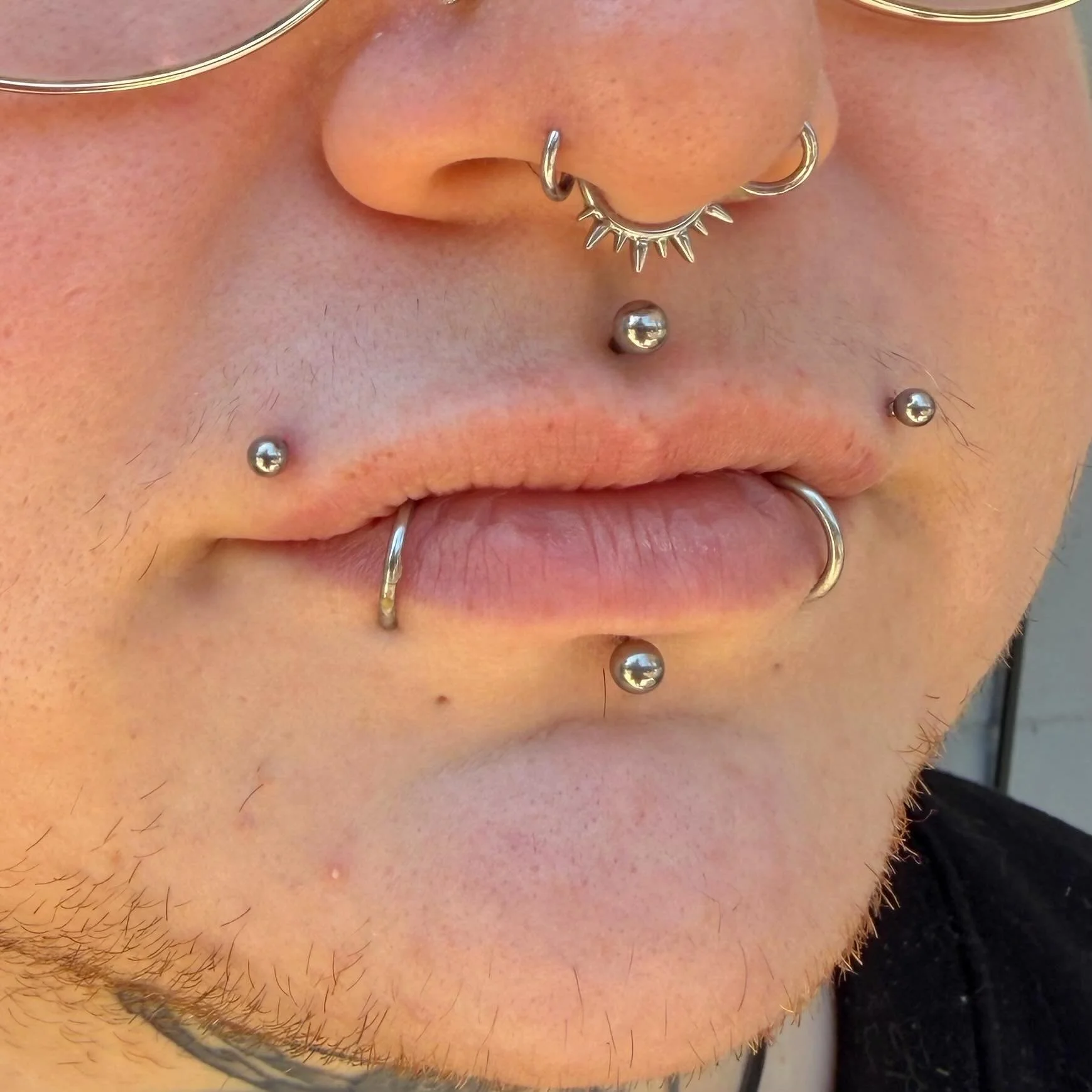 This client always requests the coolest things. Tom has done all of their previous lip piercings, and recently added the two upper ones!
