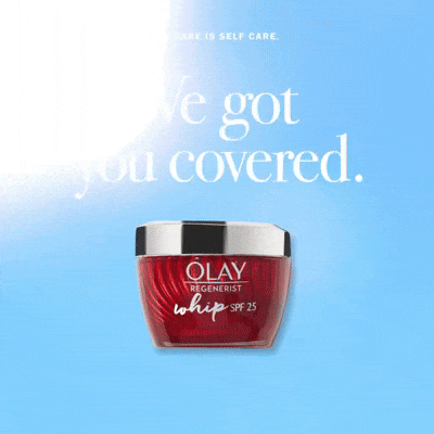 Olay Regenerist moisturizing cream jar with SPF 25 against a blue background.