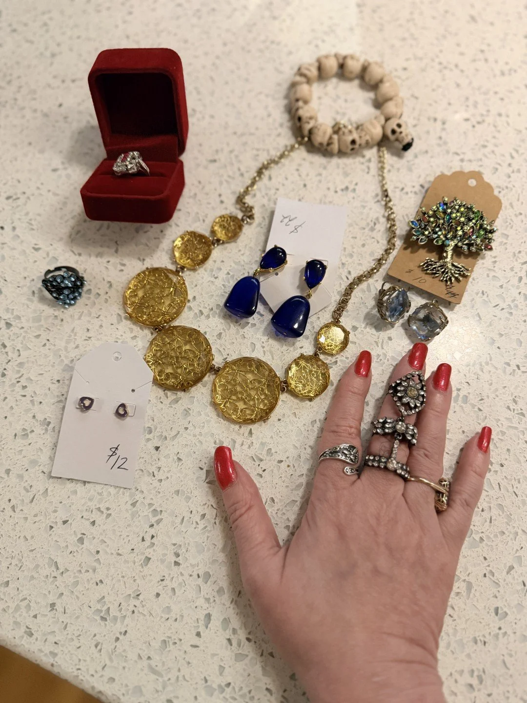 Laura's Soap Boutique had a jewelry display. The jewelry was $5 a piece. I am only human.

In my defense &mdash; and I have prepared a full defense &mdash; rings photograph beautifully on hands. This is a known fact. Hand shots are a core content for