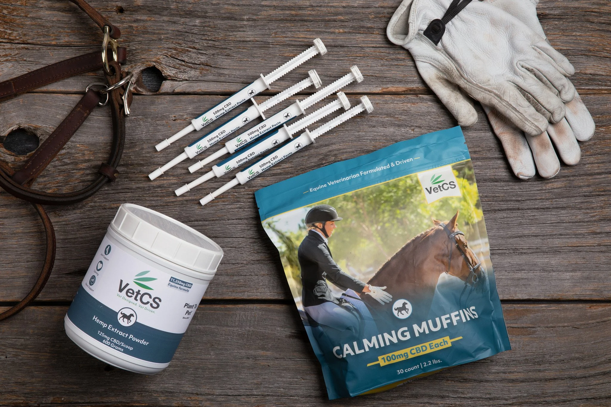 VetCS horse products laid out on a wood table.