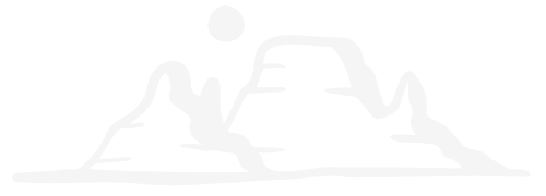 Silhouette of two mountains with a sun in the background