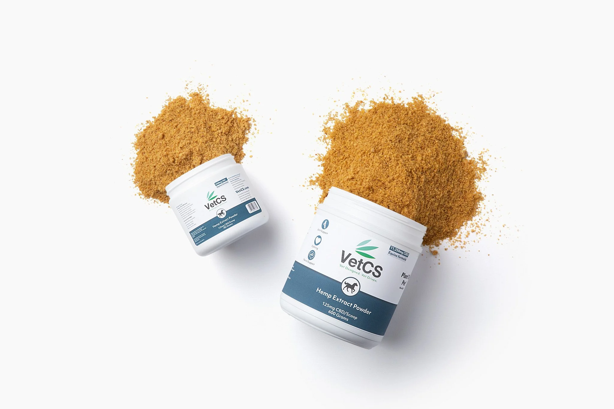 Containers labeled VetCS Hemp Extract Powder with piles of brown powder spilled around them on a white surface.