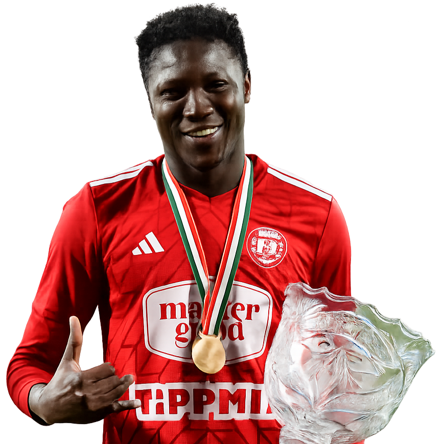 A young man in a red sports jersey with a logo, wearing a gold medal around his neck, holding a large ice sculpture, and making a 'shaka' hand gesture, smiling.