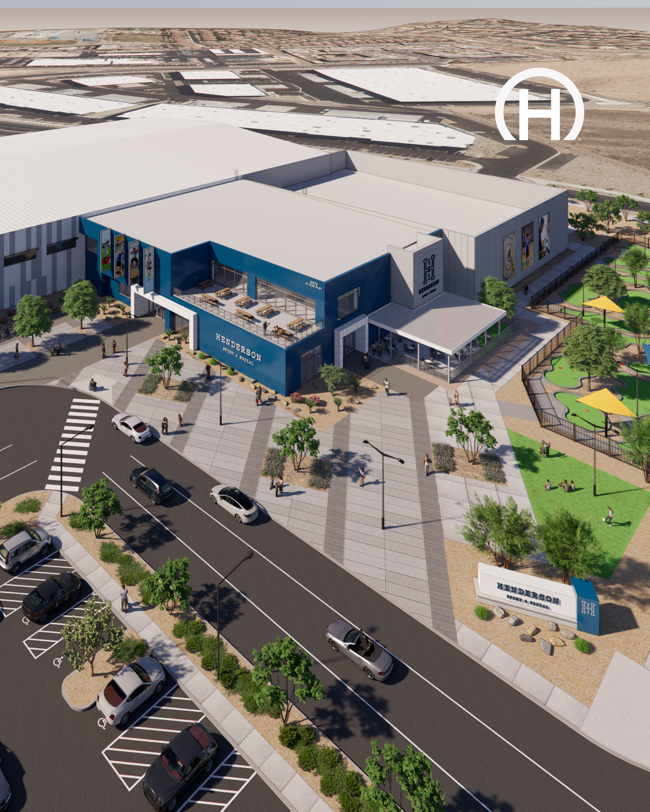 A colorful, modern sports complex with parking lot, outdoor seating, and a playground.