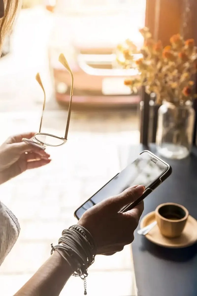 Busy NYC professional enjoying coffee after a Haus Ivy curated home reset.