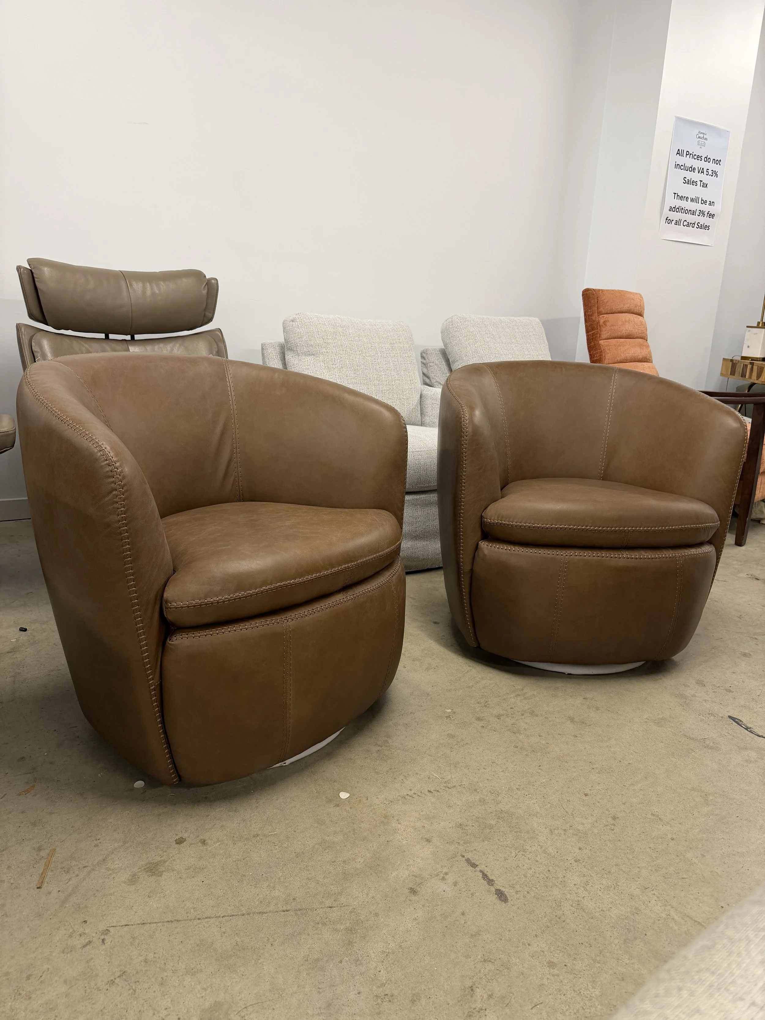 Two Leather Swivel Chairs