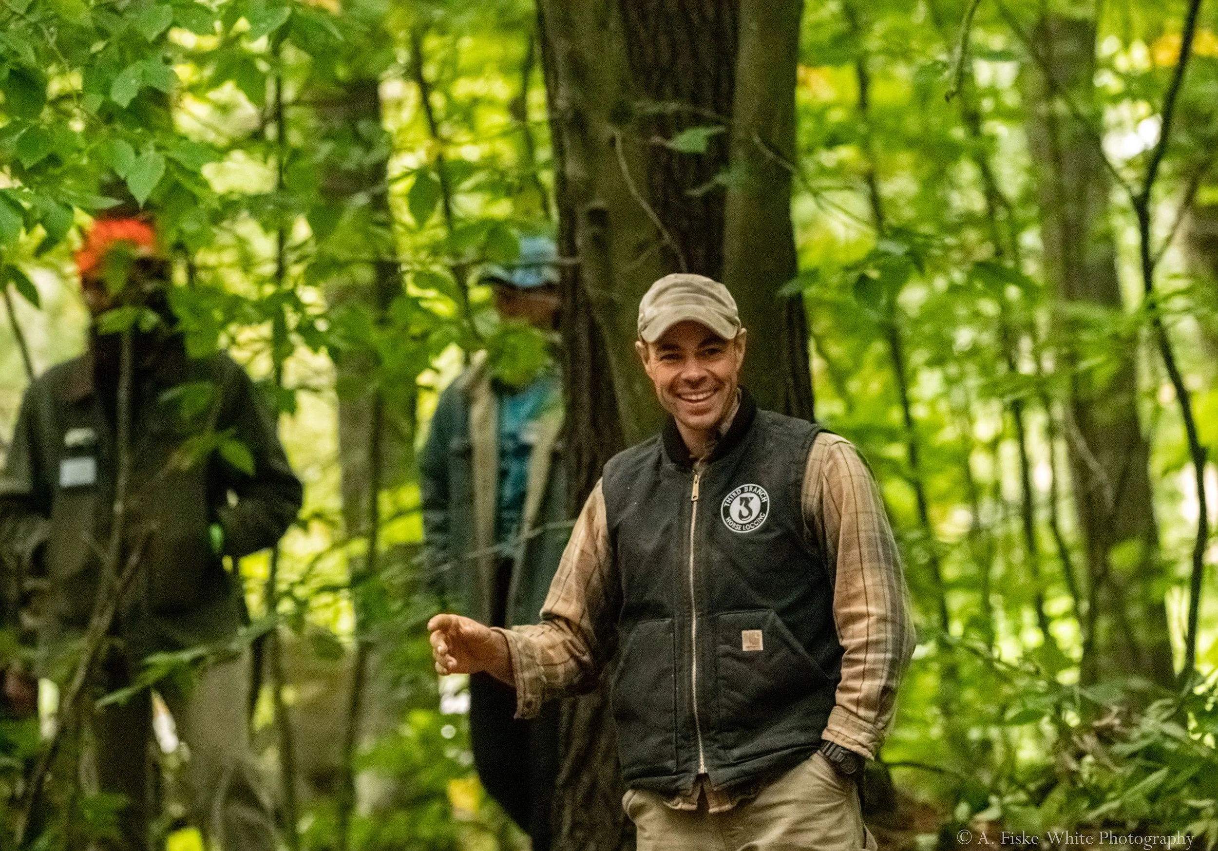 Forest worker laughing during workshop at Draft Animal Power Field Days 2023.
