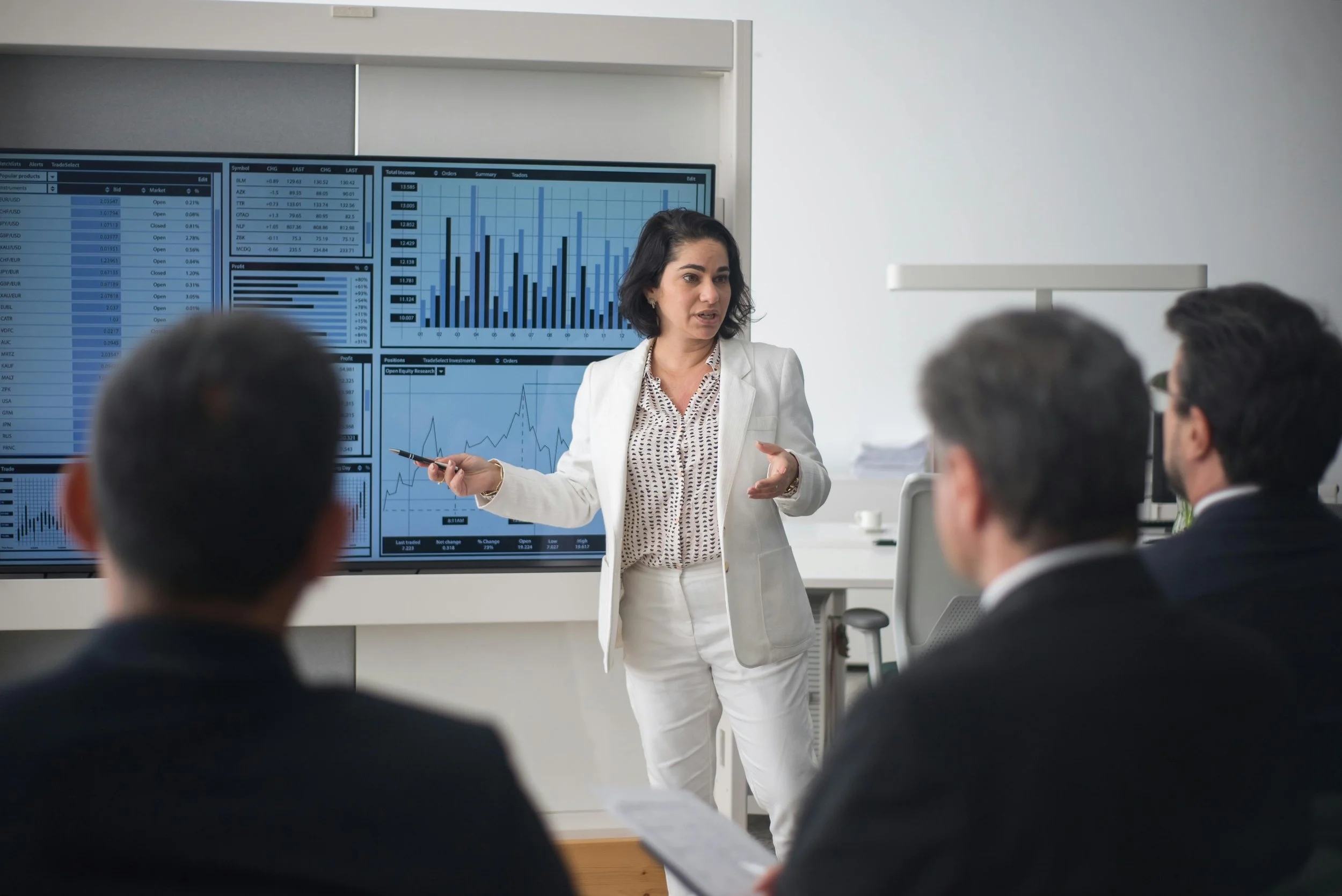 A woman giving a presentation in an office