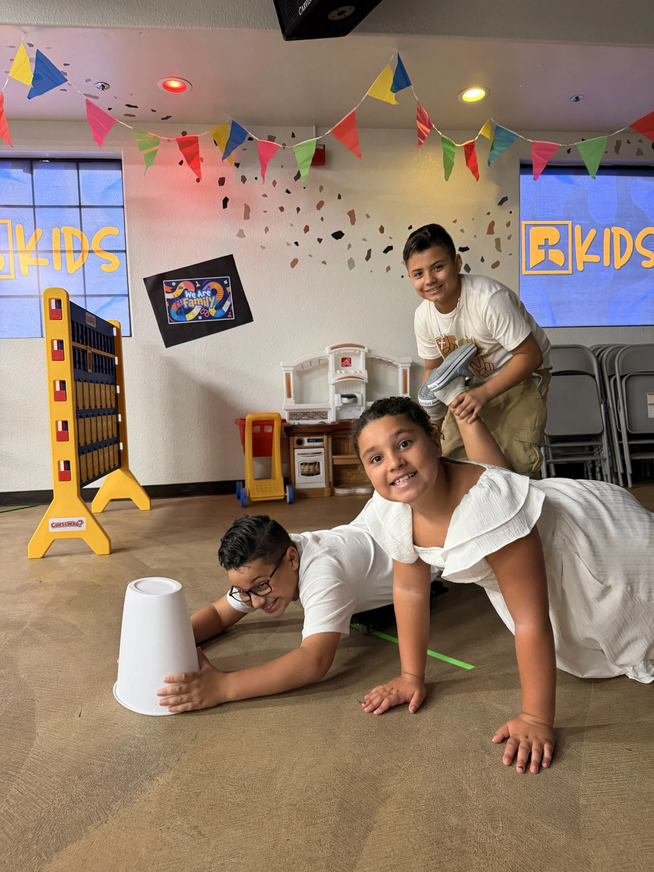 Four children playing a game in kids ministry at alpine Bethel church San Diego