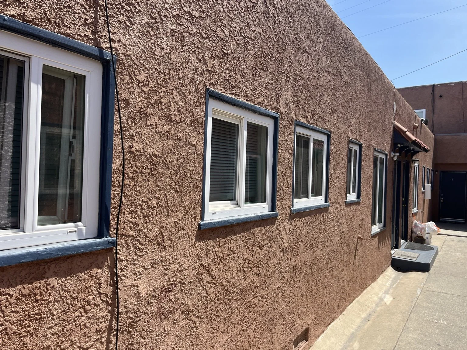 Multiple custom window screens installed on a Southern California property