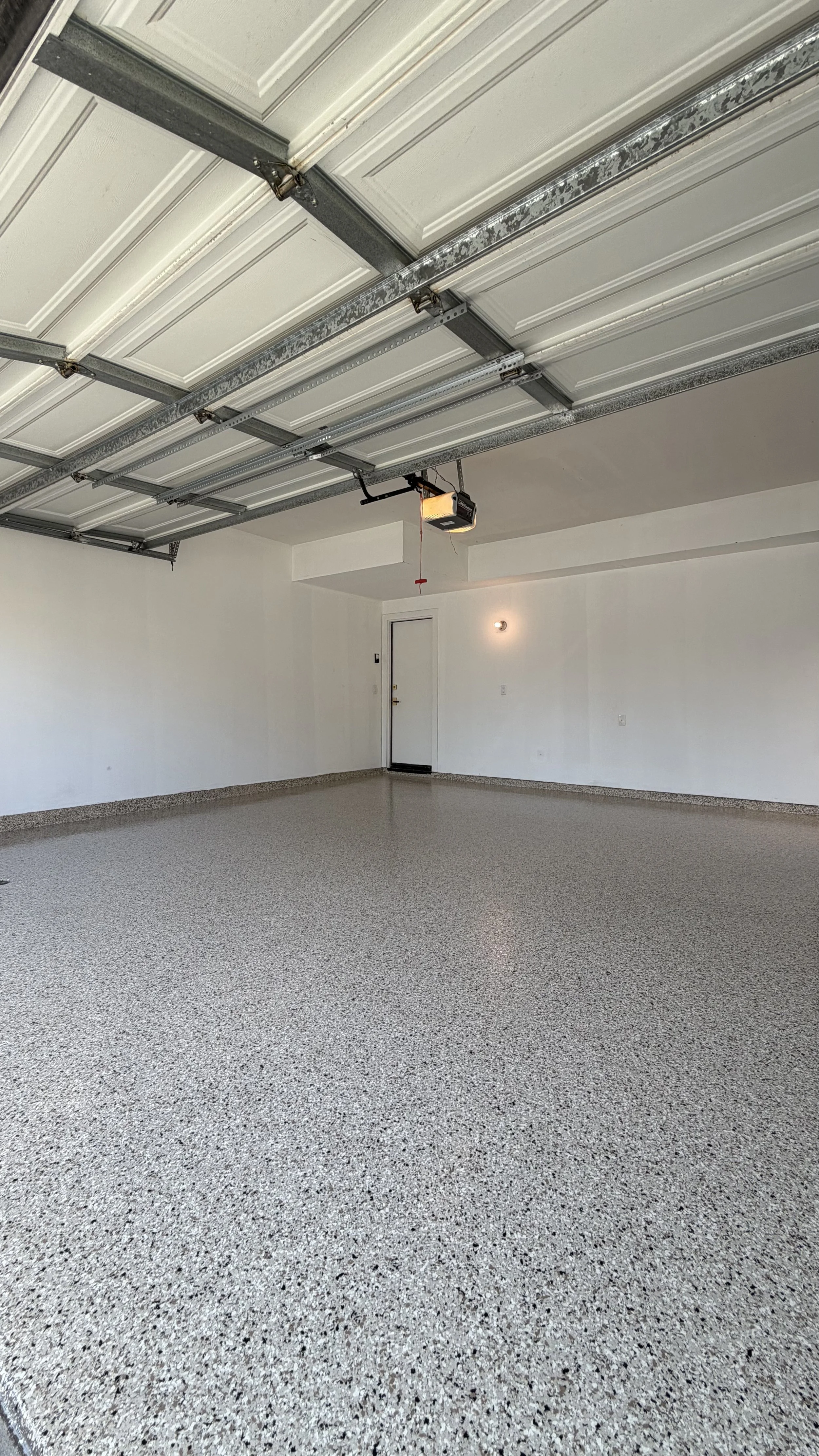 Full flake epoxy garage floor in Shoreline blend, installed in Newport Beach, CA