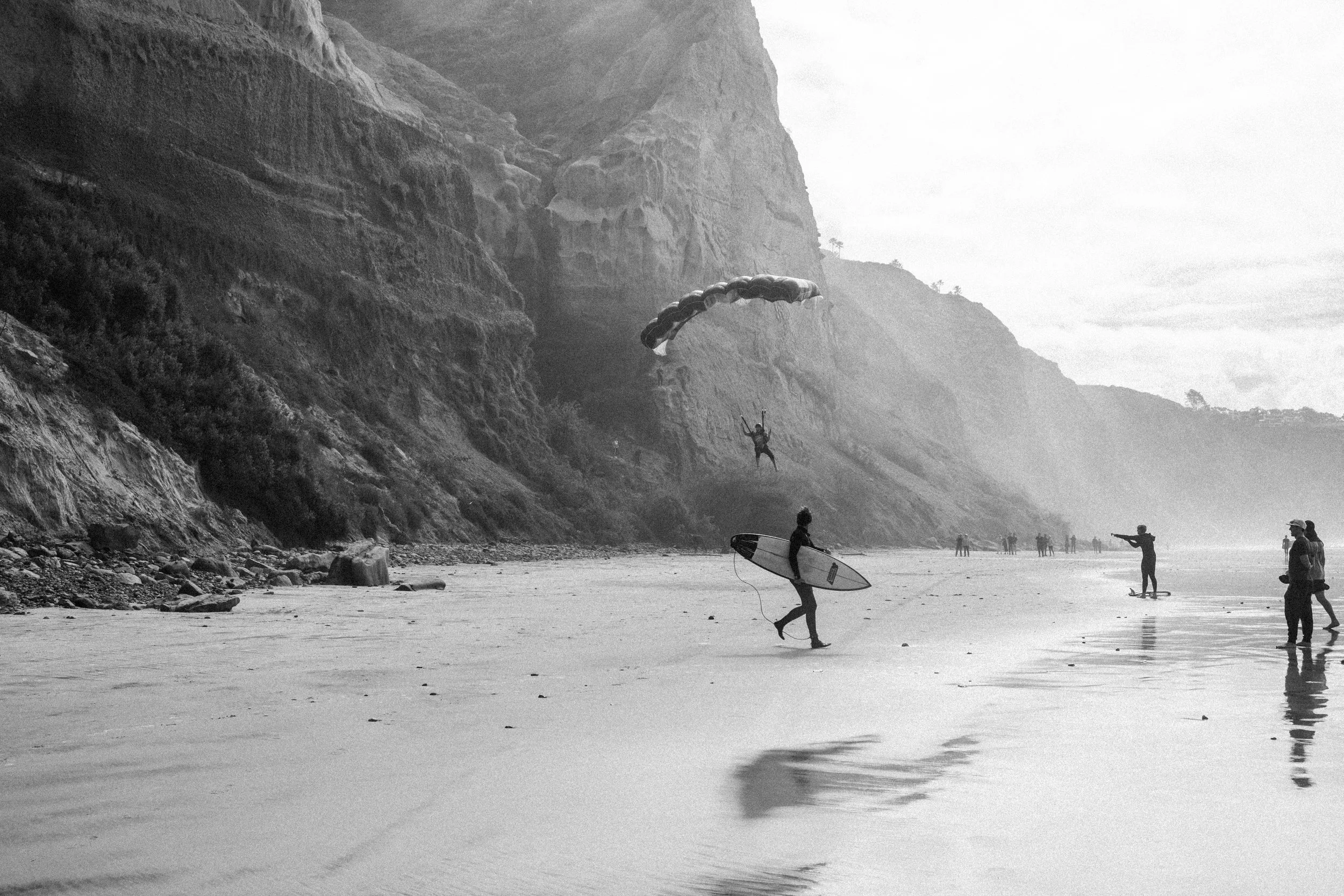  Walking down the beach after the session, I saw a man standing on the edge of the cliff. He jumped, and only in mid-flight did it become apparent that this was a calculated move. 