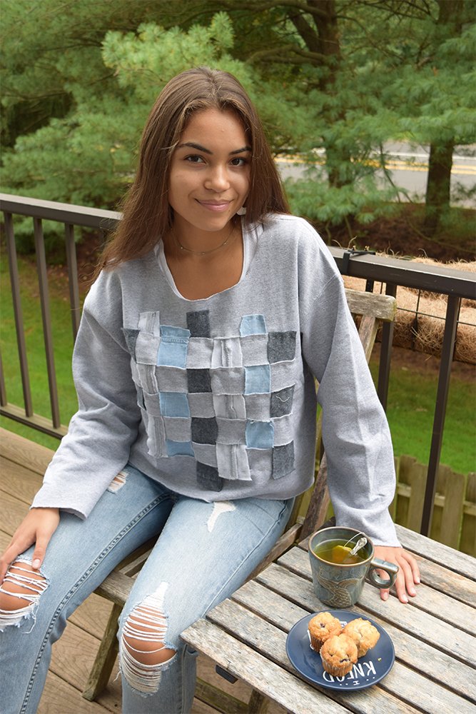 Girl wearing patch sweater