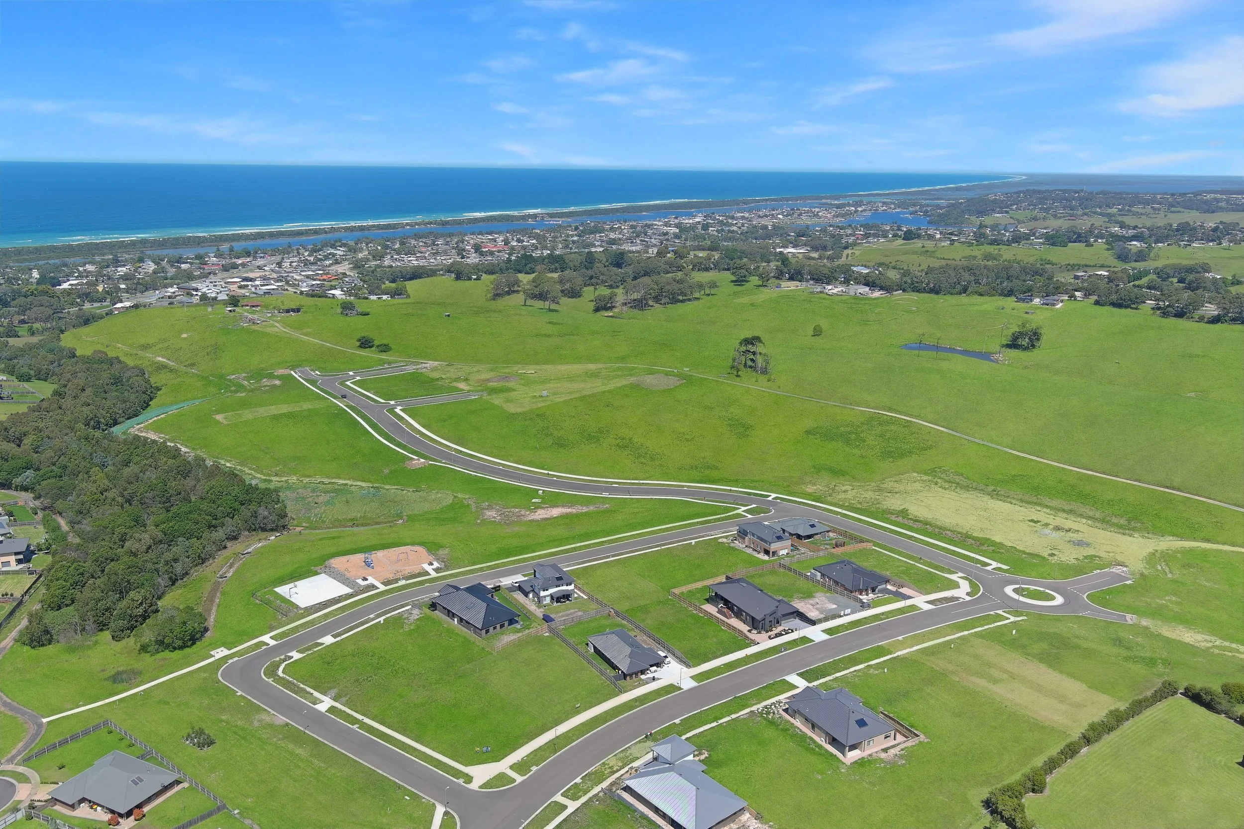 Aerial view of Coastal View Estate in Lakes Entrance showing large residential lots, new homes and coastal views.