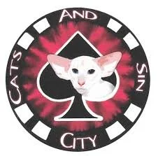 Logo featuring a white cat's face in the center of a black spade symbol, with a pink and black background. Text around the logo reads "CATS AND SIN CITY."