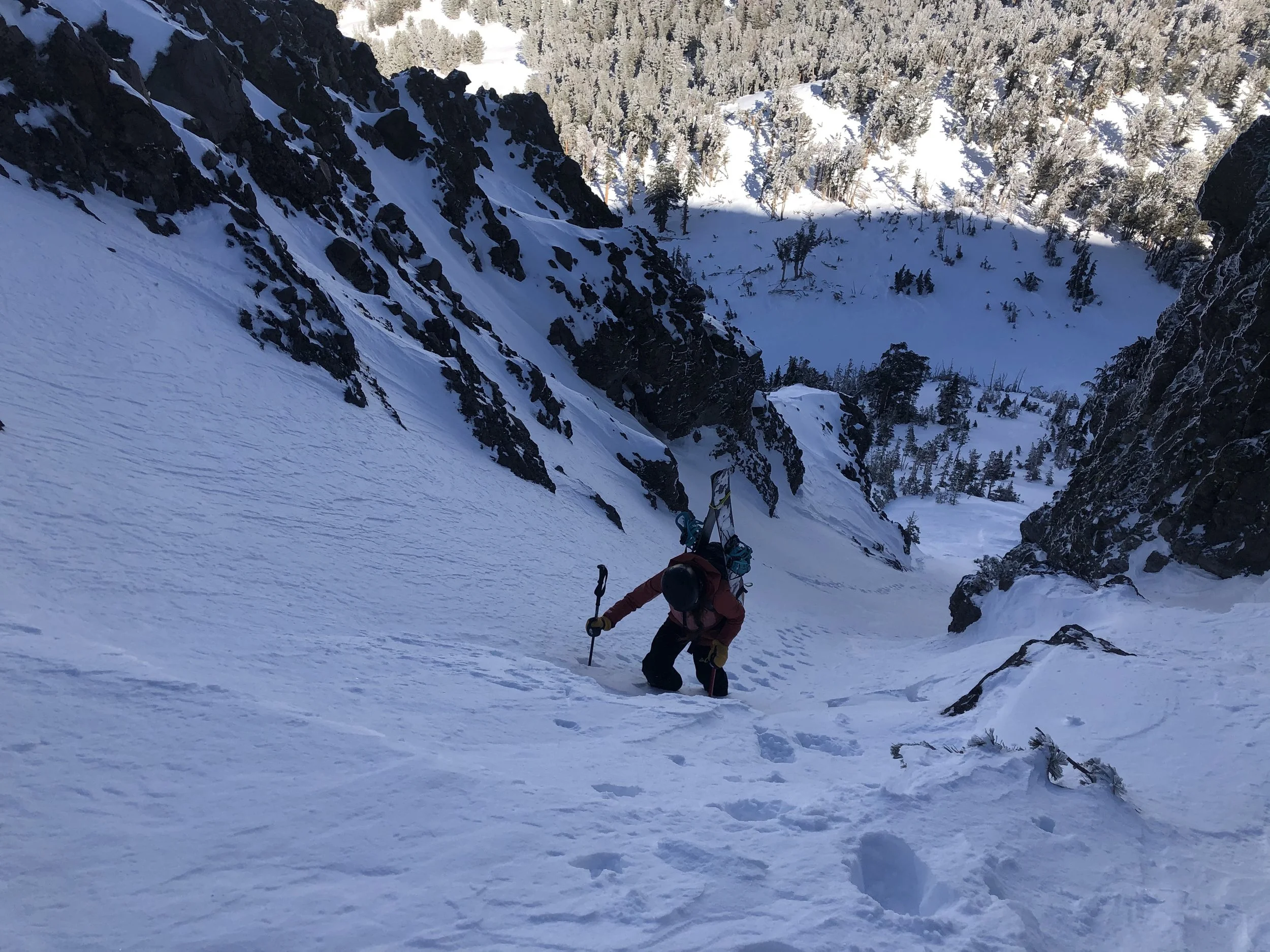 woman climbing mountain snowboard splitboard Tahoe mammoth
