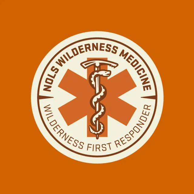Logo of Wilderness Medicine First Responder with a caduceus symbol and the words 'NOLS Wilderness Medicine' and 'www.nols.edu' on an orange background.