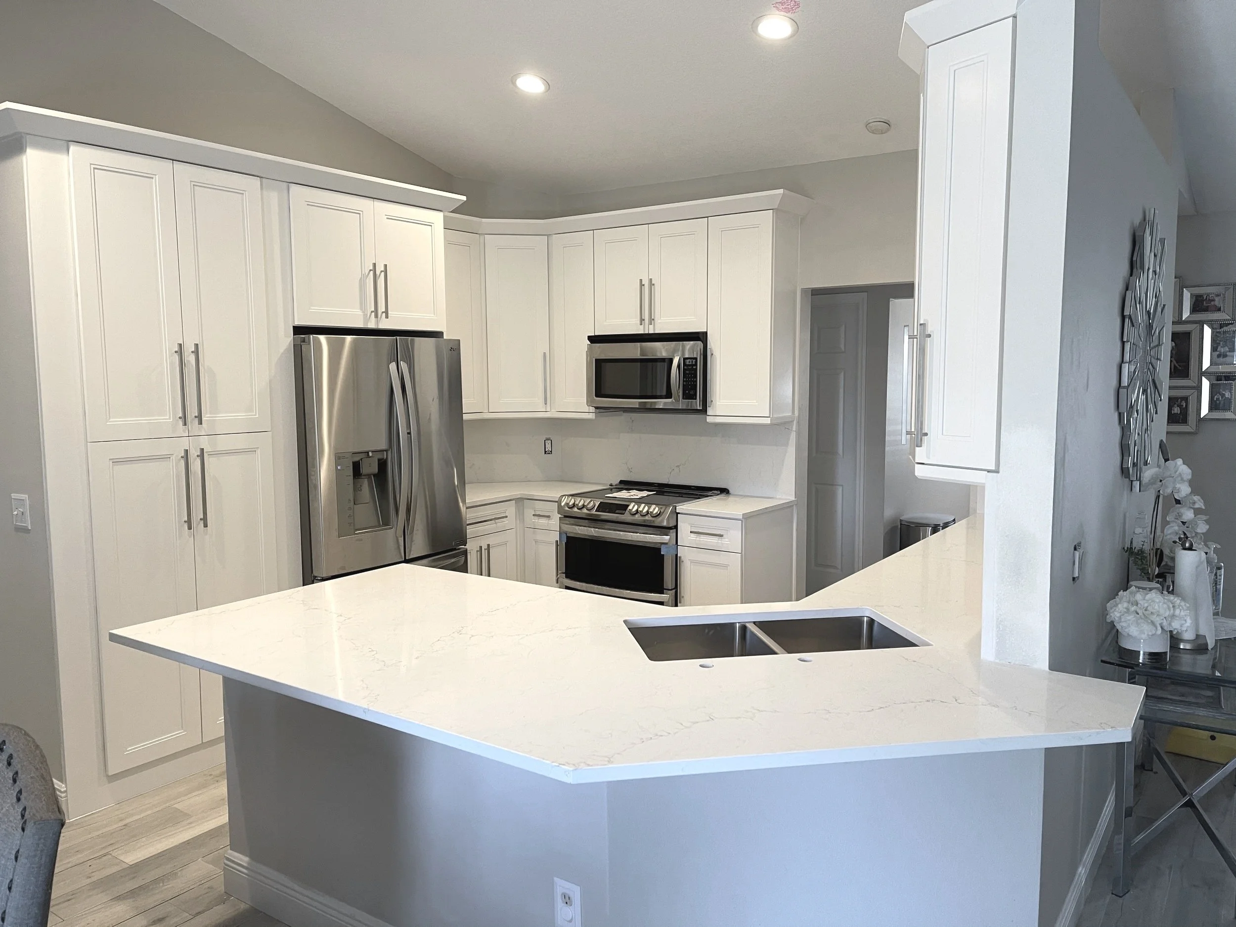 White Perimeter Cabinets With A Gray Island Base Kitchen Remodel by EZ Cabinets & Granite project photo
