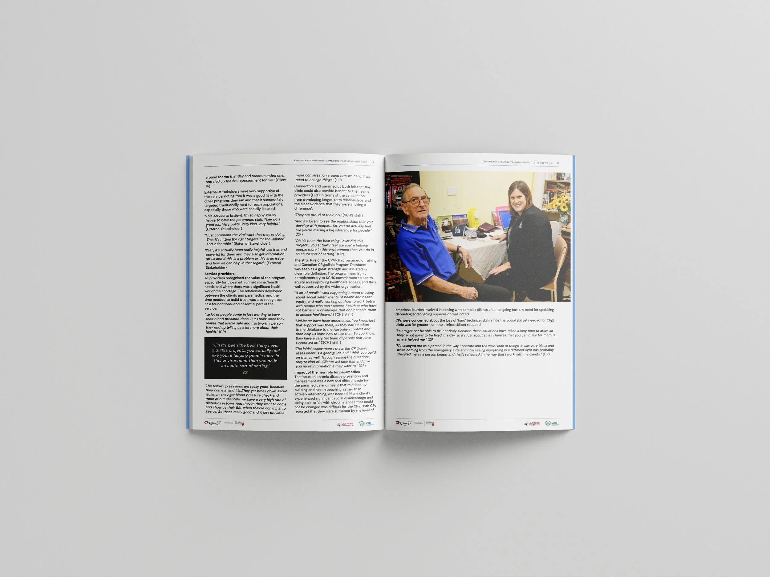 Open magazine with two pages. The left page has text and a small black and white photo, the right page features a color photo of an elderly man and a young woman sitting at a desk in an office, smiling.