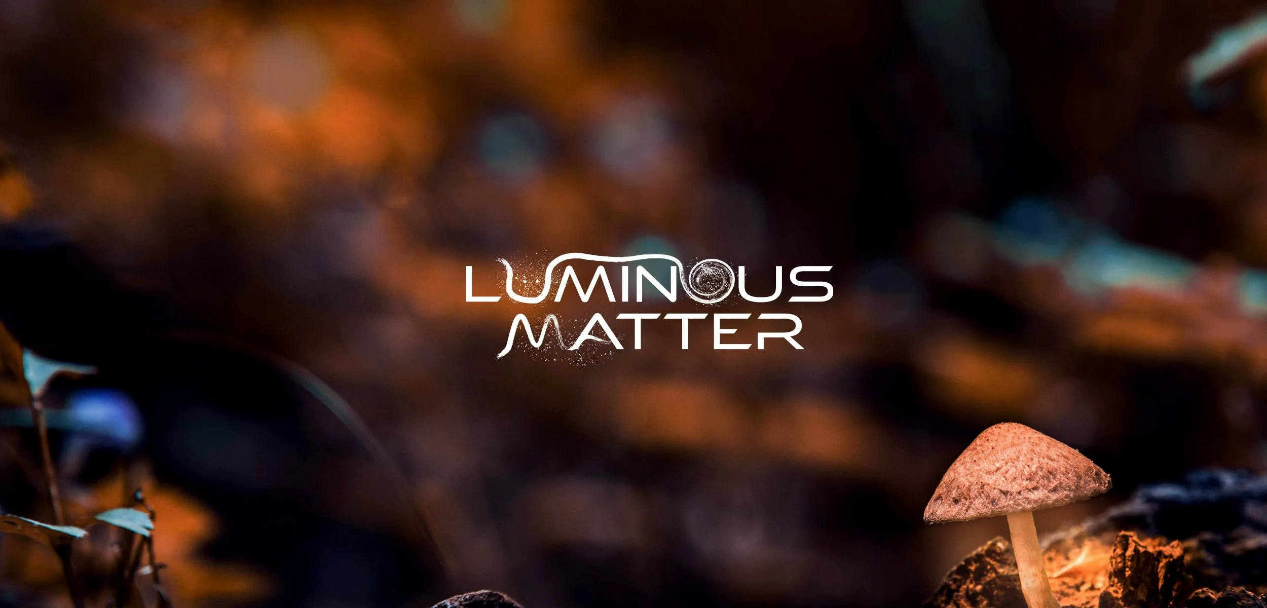 Close-up of a small mushroom growing in a natural setting with text overlay that reads 'Luminous Matter' on a blurred background of forest floor and foliage.
