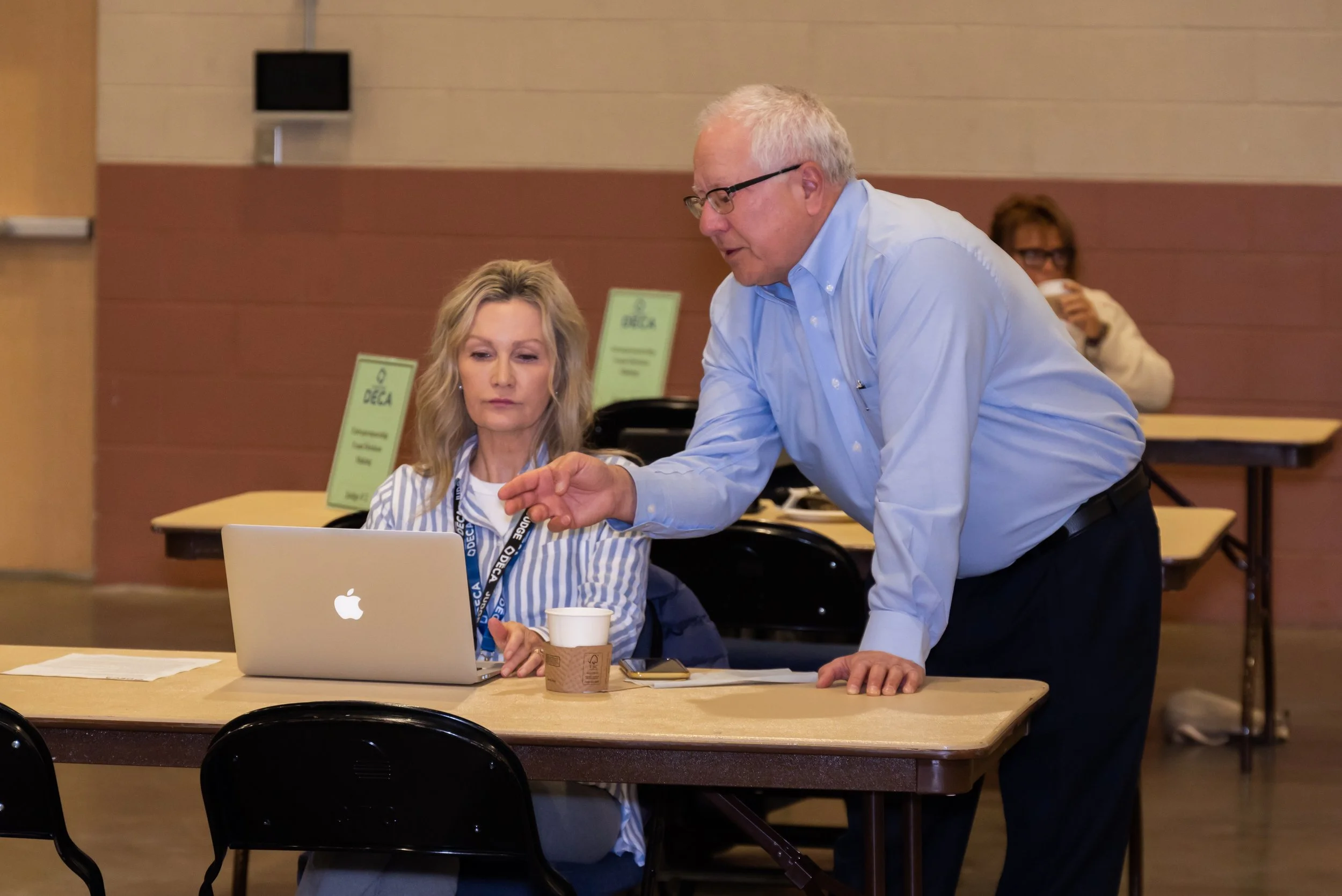 Two volunteer judges at the State Career Development Conference.