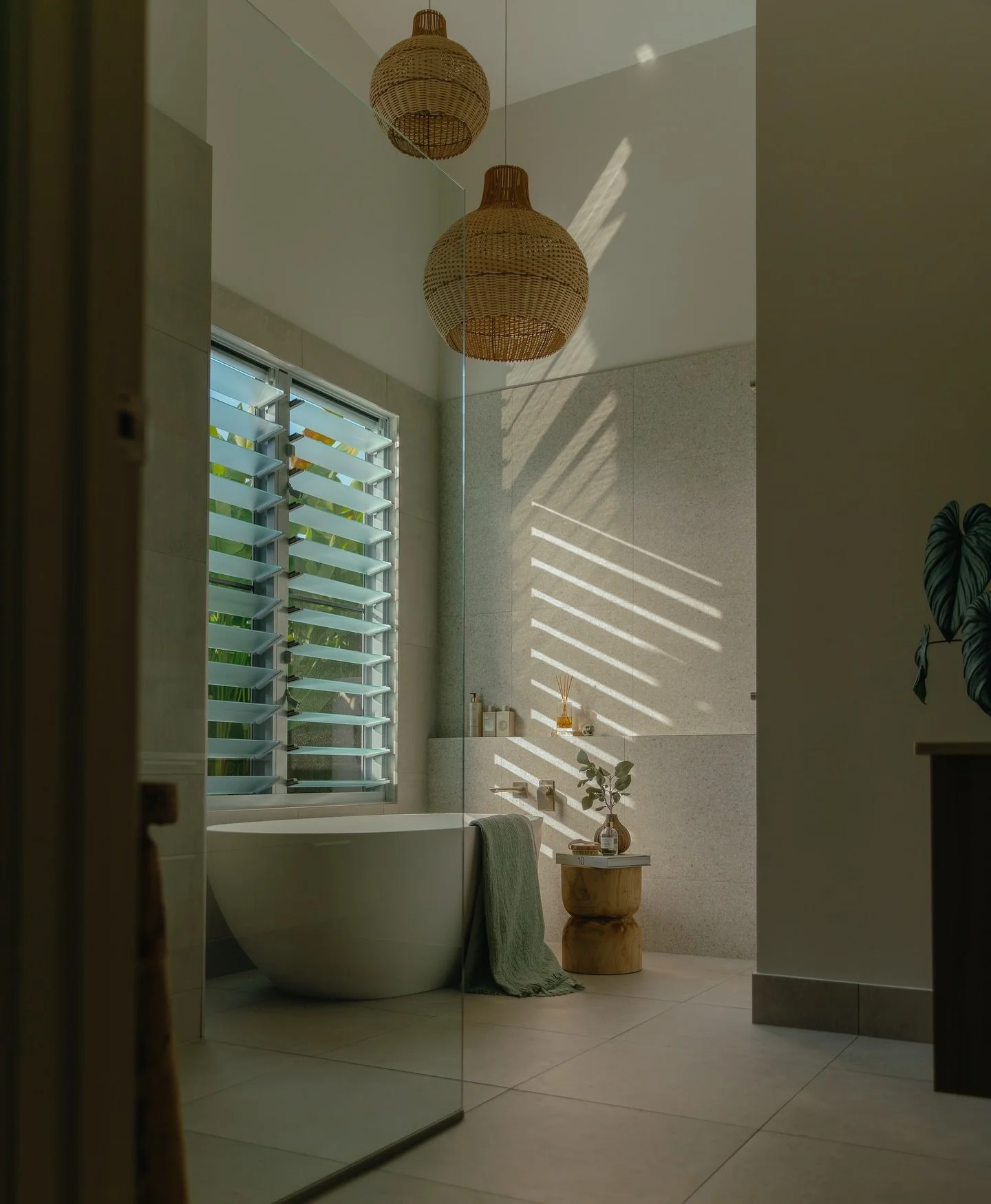 a space to unwind&hellip; 

We lifted the ceiling in this bathroom to frame these Bondi Rattan Pendants Lights - adding height, natural light, and a quiet sense of grandeur.

Lighting: @ivoryanddeene 
Tiles: @naturaltileshowroom 
Bath: @highgrovebath