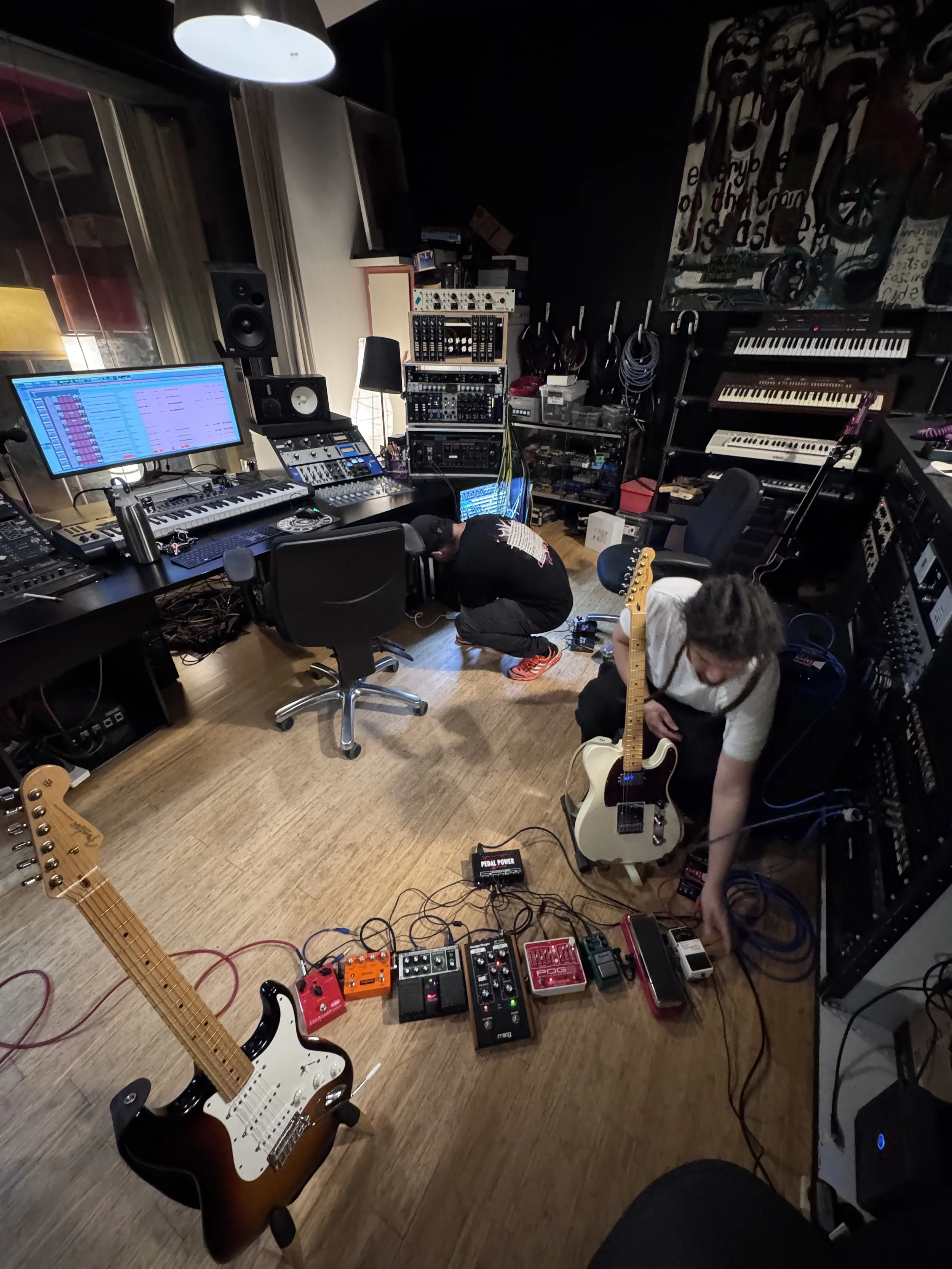 Recording studio with guitars, keyboards and professional production equipment