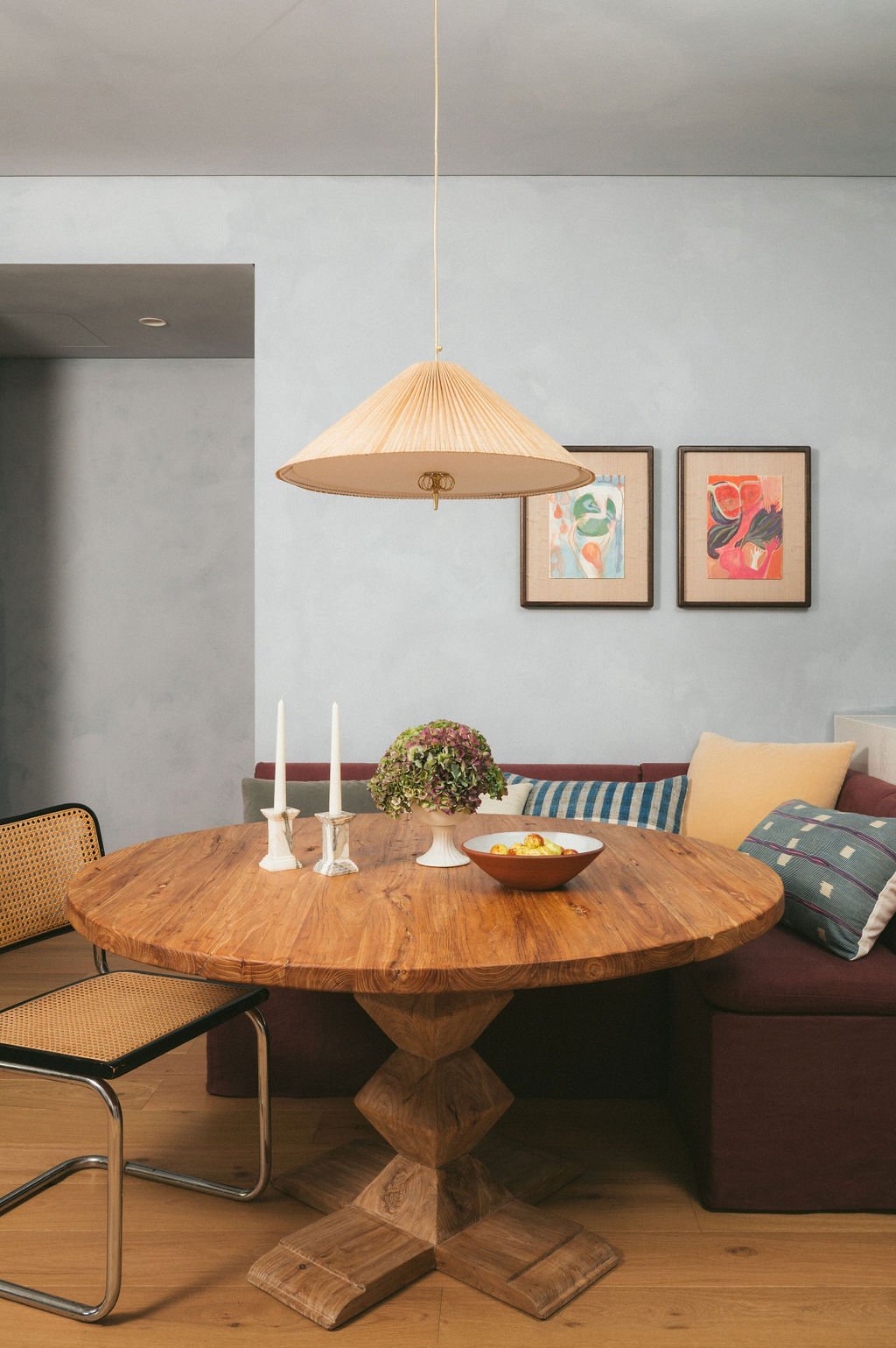 Round dining table with pendant and bench