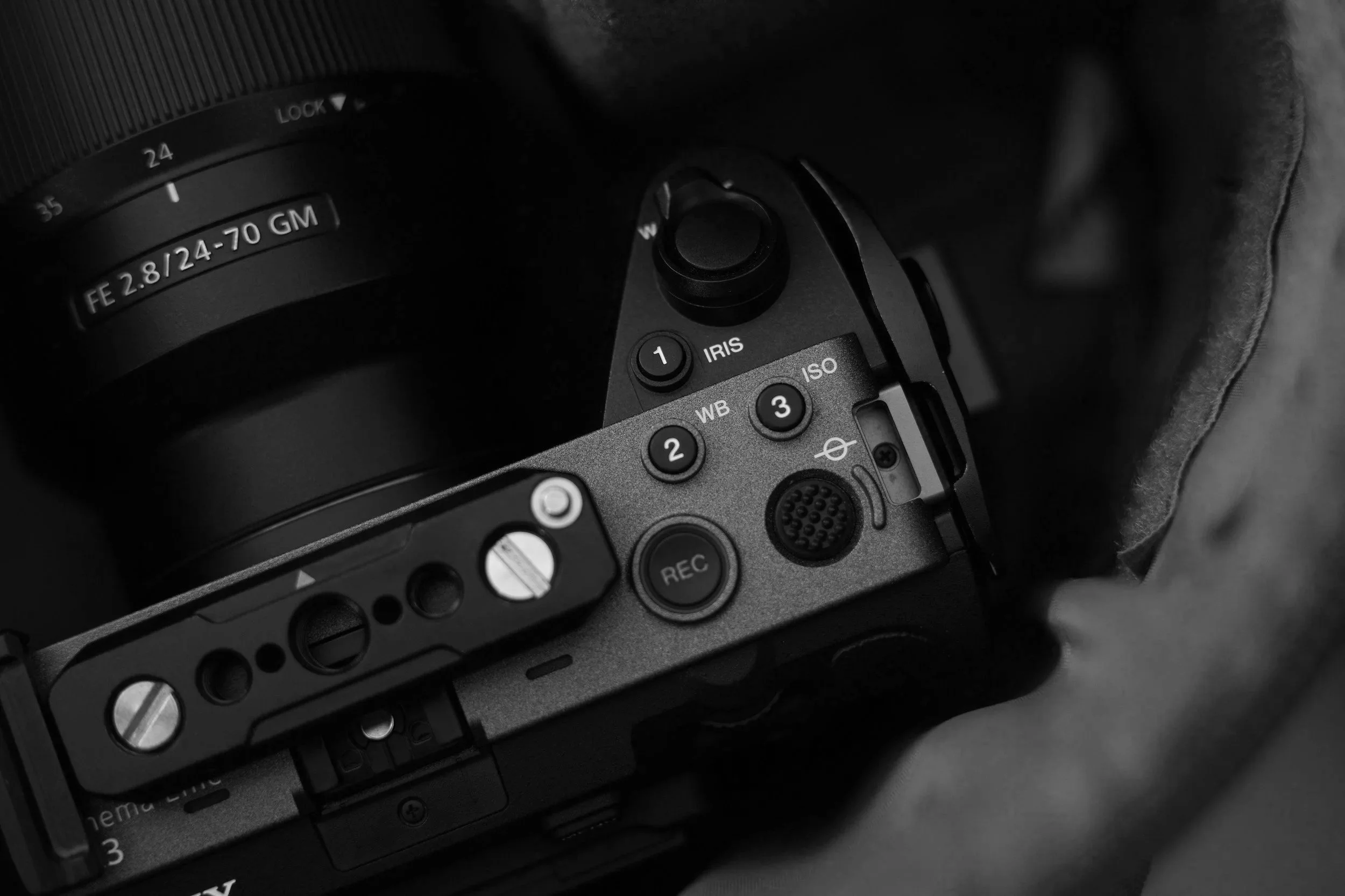 Close-up of a professional camera with various buttons and dial controls.