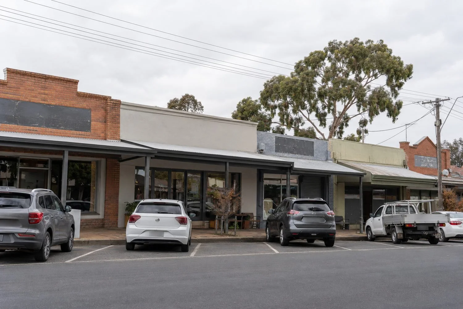 Suburban strip retail shopfronts where council rates, insurance and other commercial property outgoings decide what the owner keeps