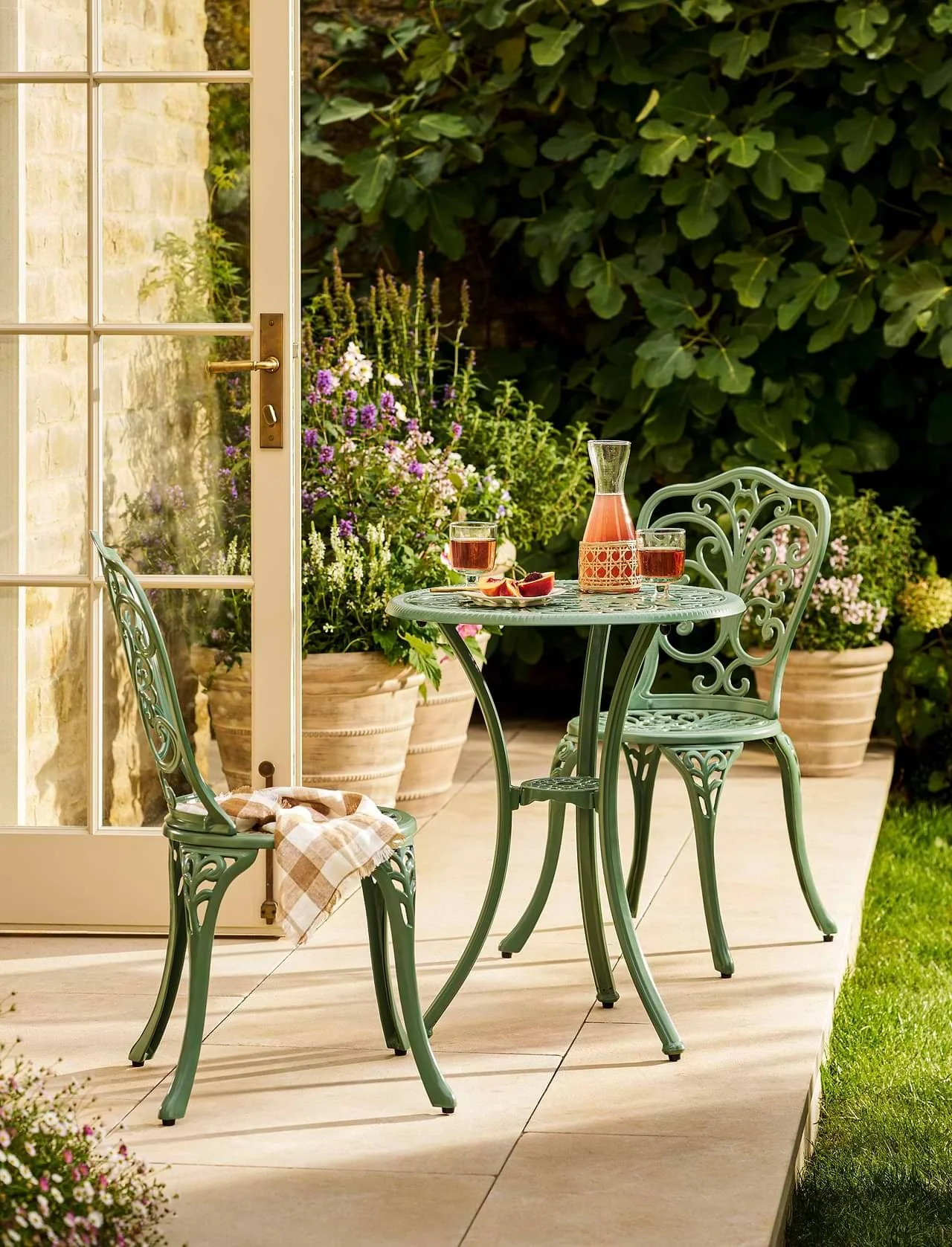 Modern outdoor table set on porcelain patio UK