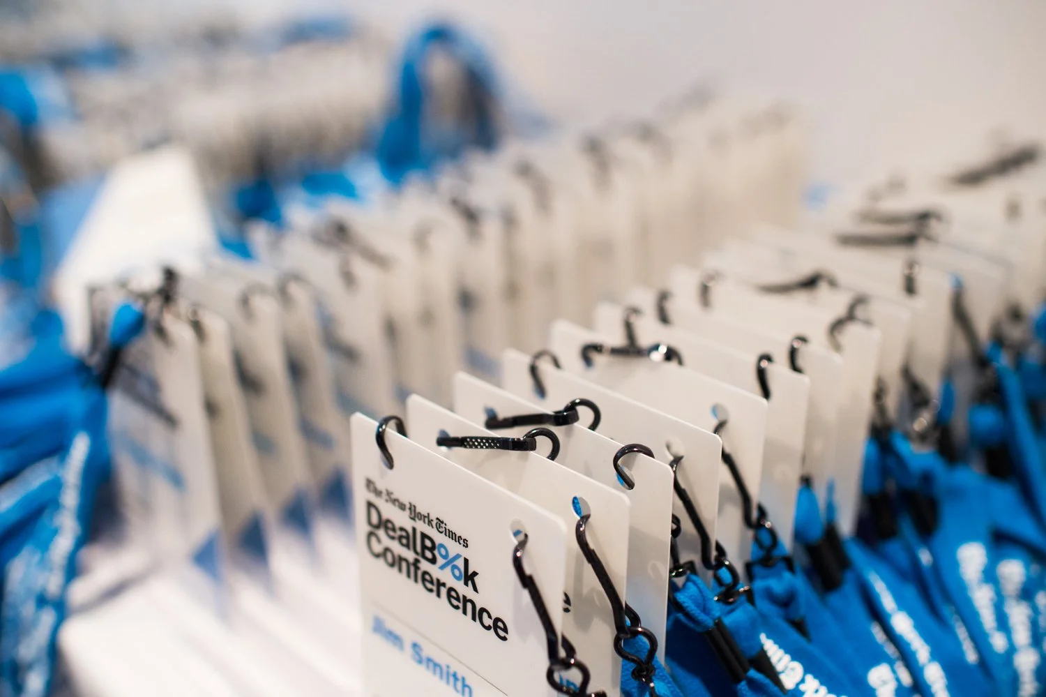  The clips on the lanyards match the badges. Nobody notices, which is the point, coherence is felt before it's seen. 