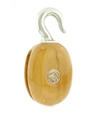 A wooden block with a metal bracket and a circular logo on the front.