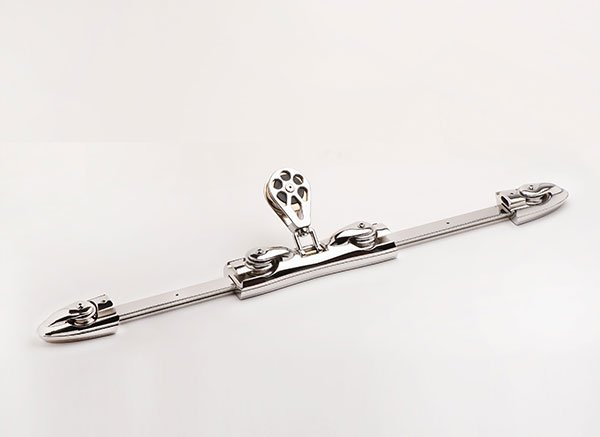 A metallic lock and bar with a keyhole and hinges, designed for security.