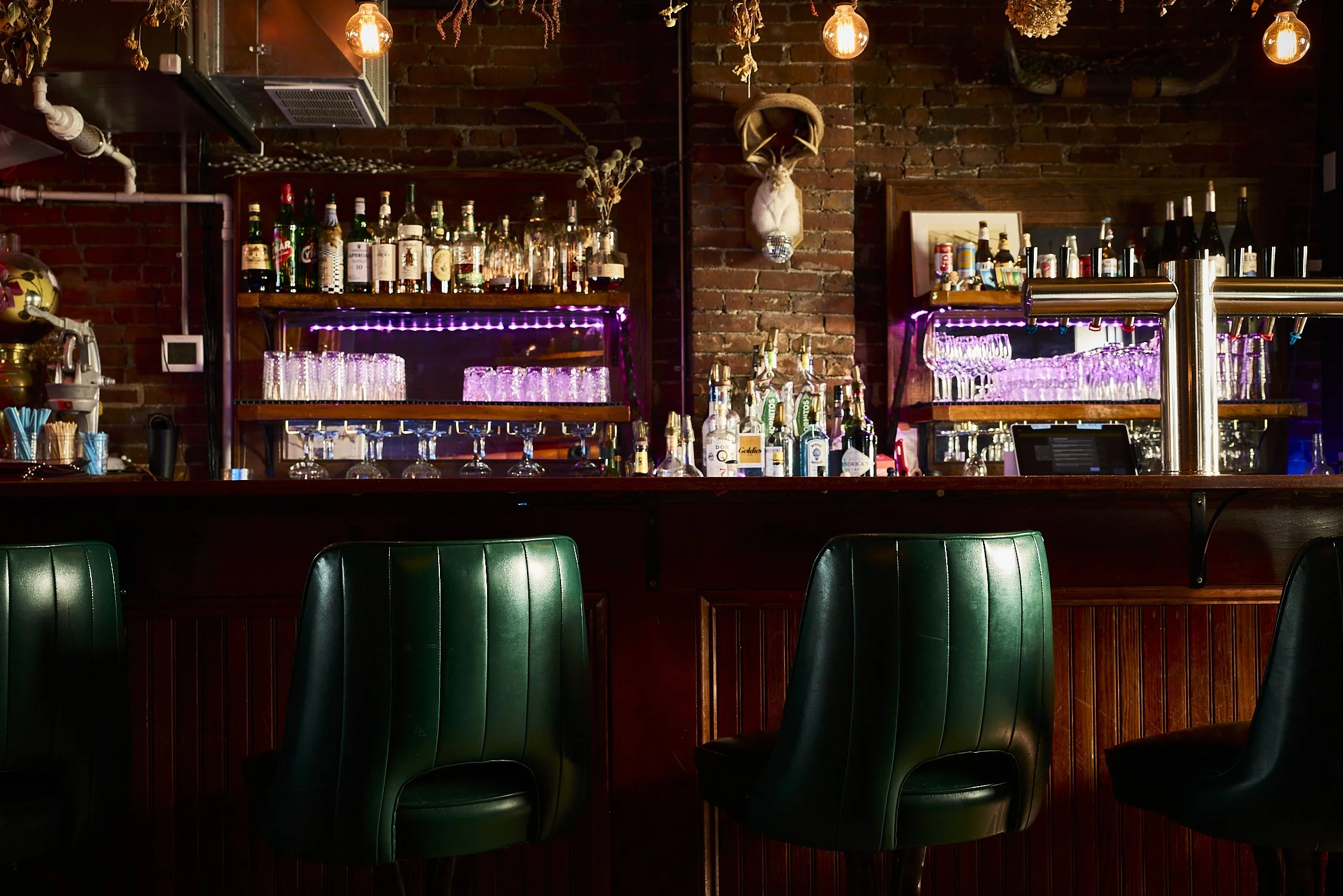 upstairs bar with confortable high back seating