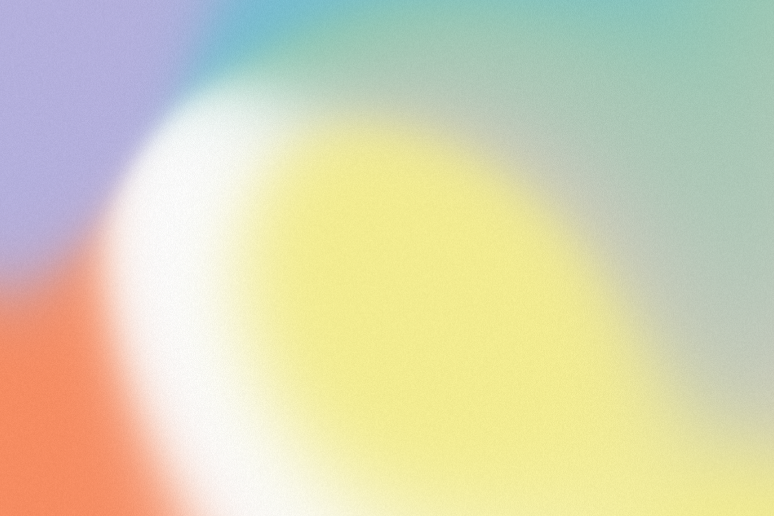 Blurred, colorful abstract background with gradient colors including blue, green, yellow, white, orange, and purple.