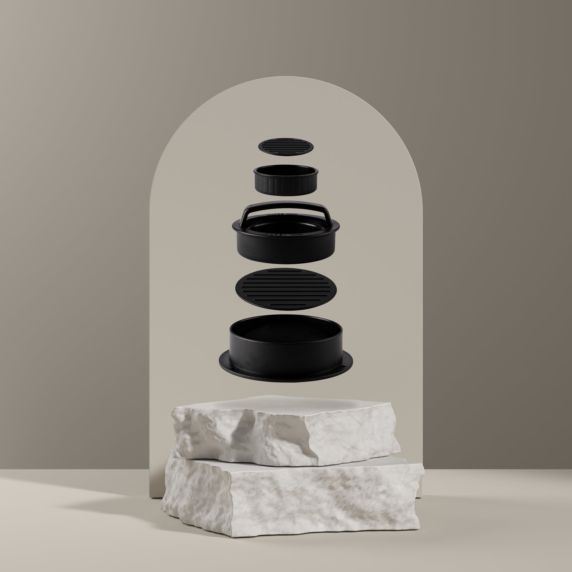 Disassembled black kitchen air fryer parts floating above two stacked white rocks, set against a minimalist beige background with a rounded arch.