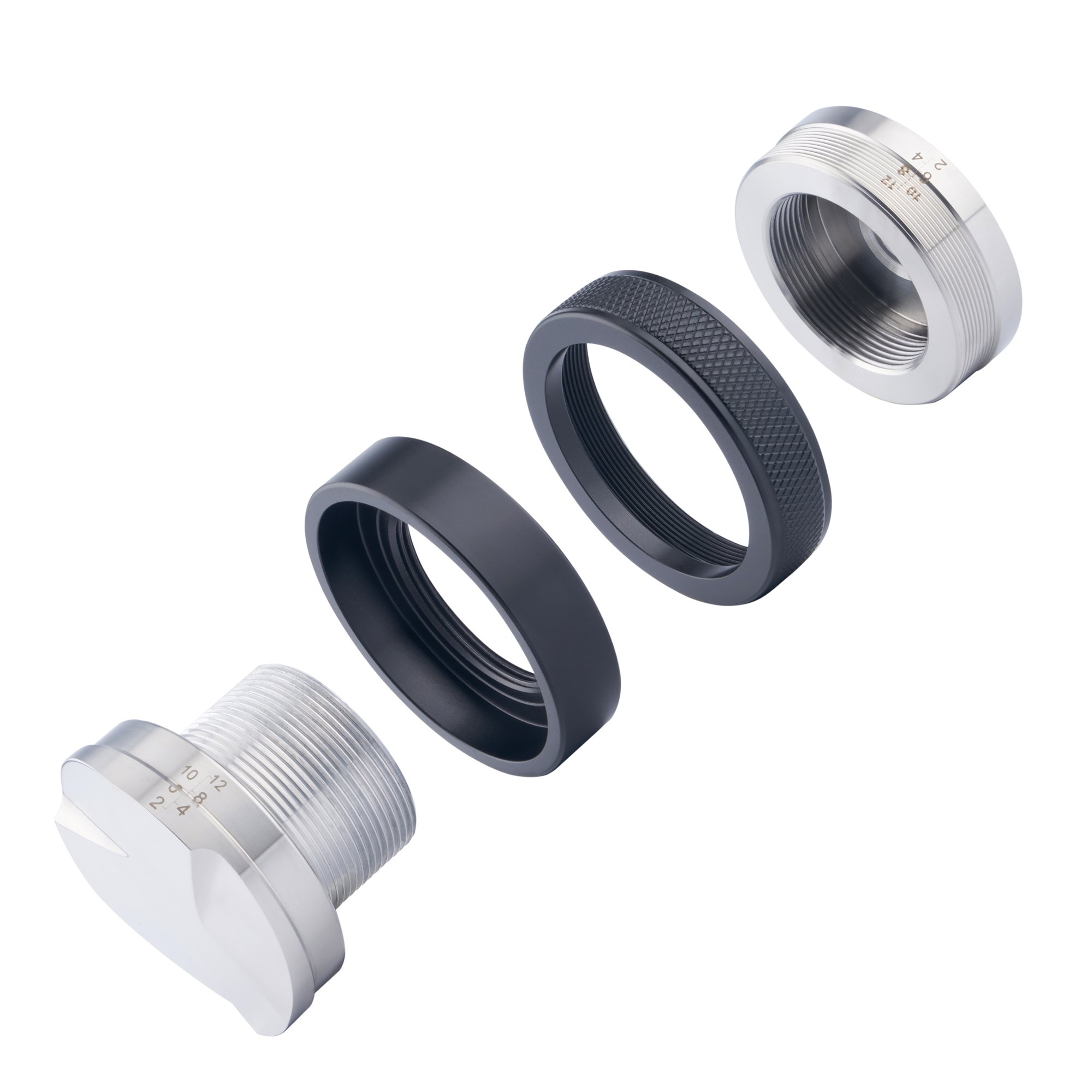 Disassembled camera lens rotating rings and metal filter threads.